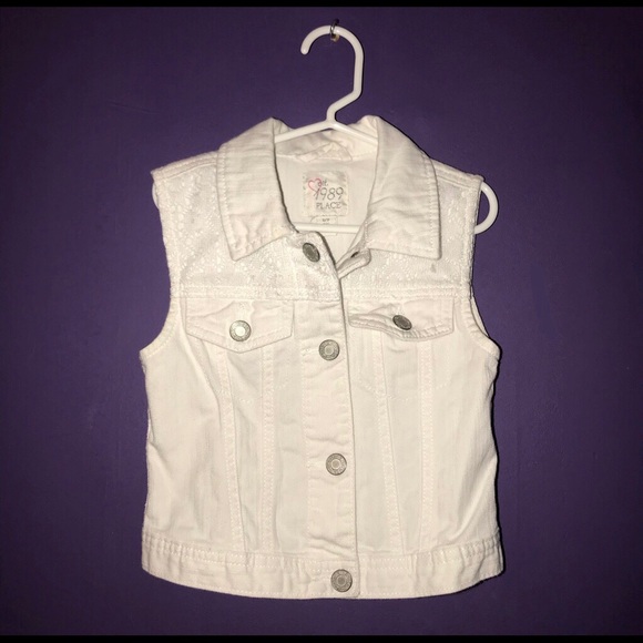 white sleeveless jean jacket